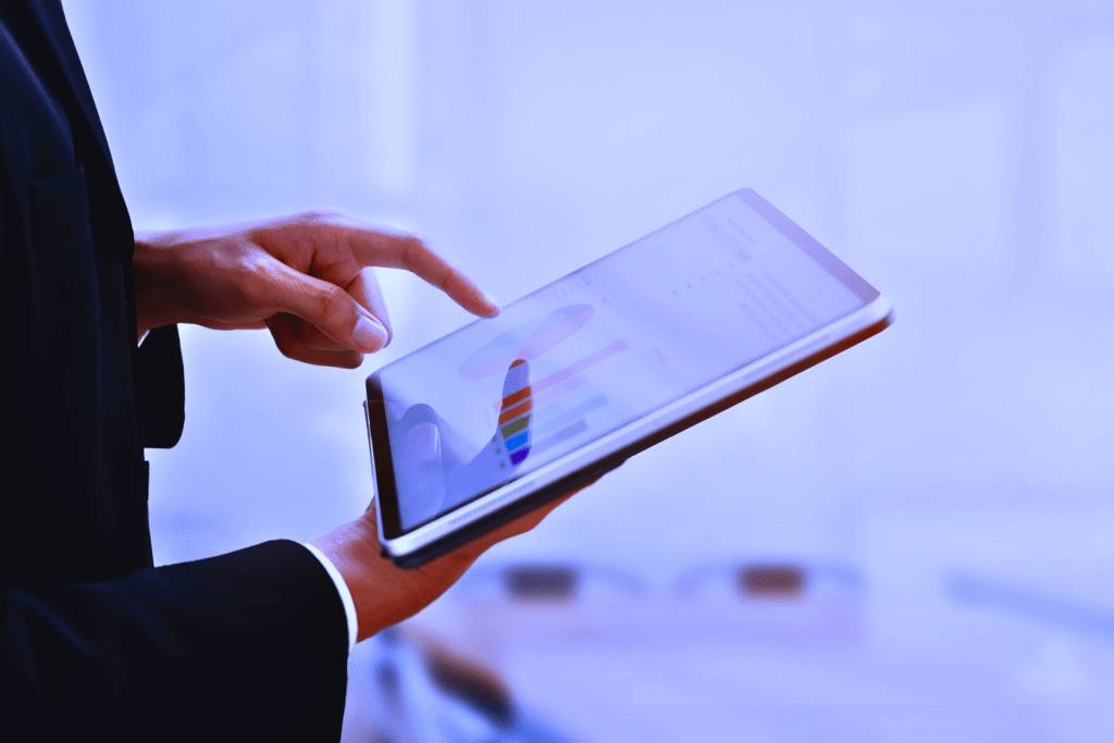 Measuring Success - Man checking Analytics in a Tablet